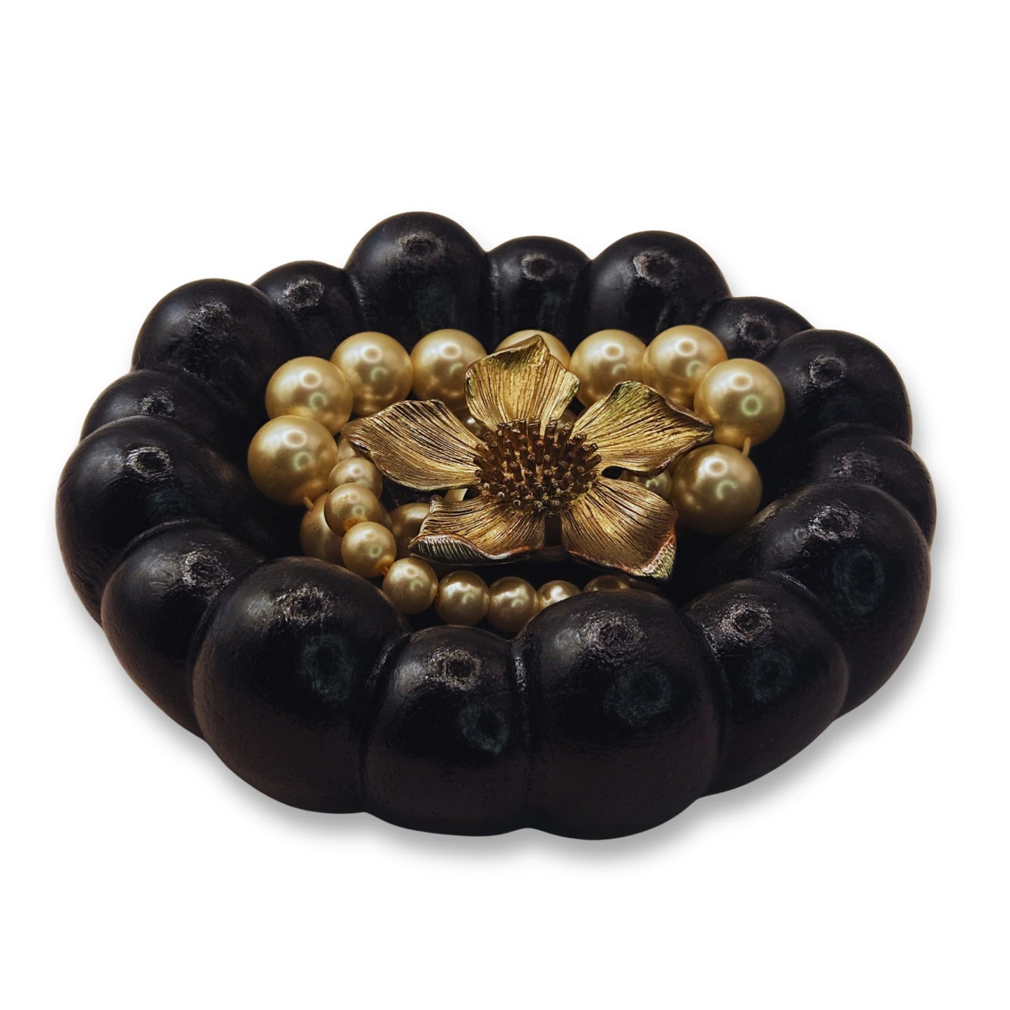 Black Cloud Jewellery Bowl with gold flower clasp and pearl accents on a white background