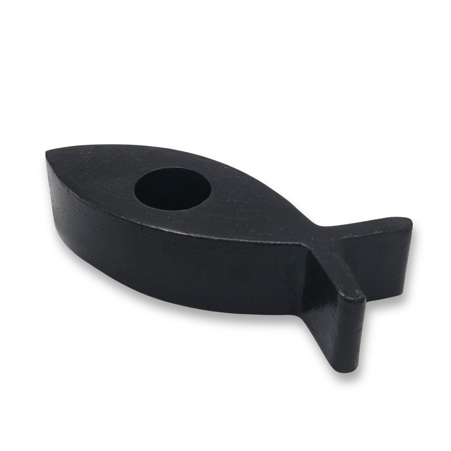 Black fish-shaped candle holder on a white background