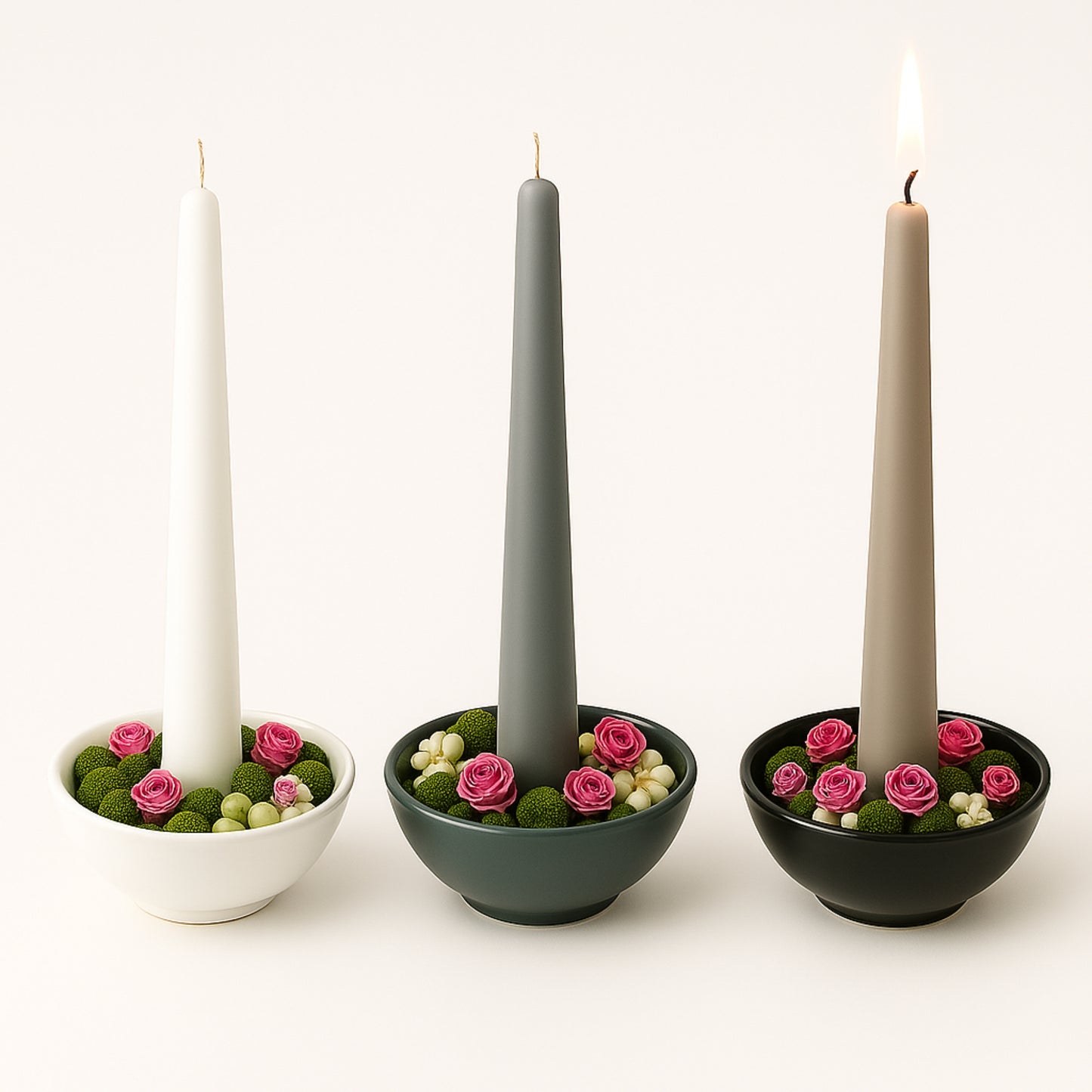 Three items with candles and decorative flowers on a white background