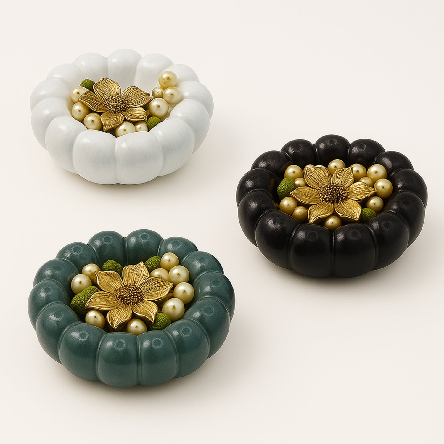 Three decorative bowls with jewellery in them resembling bubbly clouds