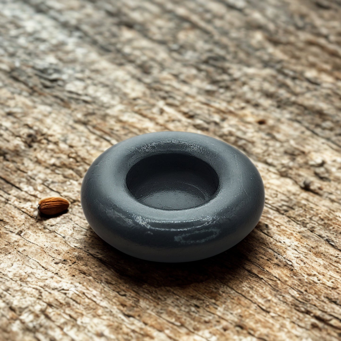 Gray object on a wooden surface