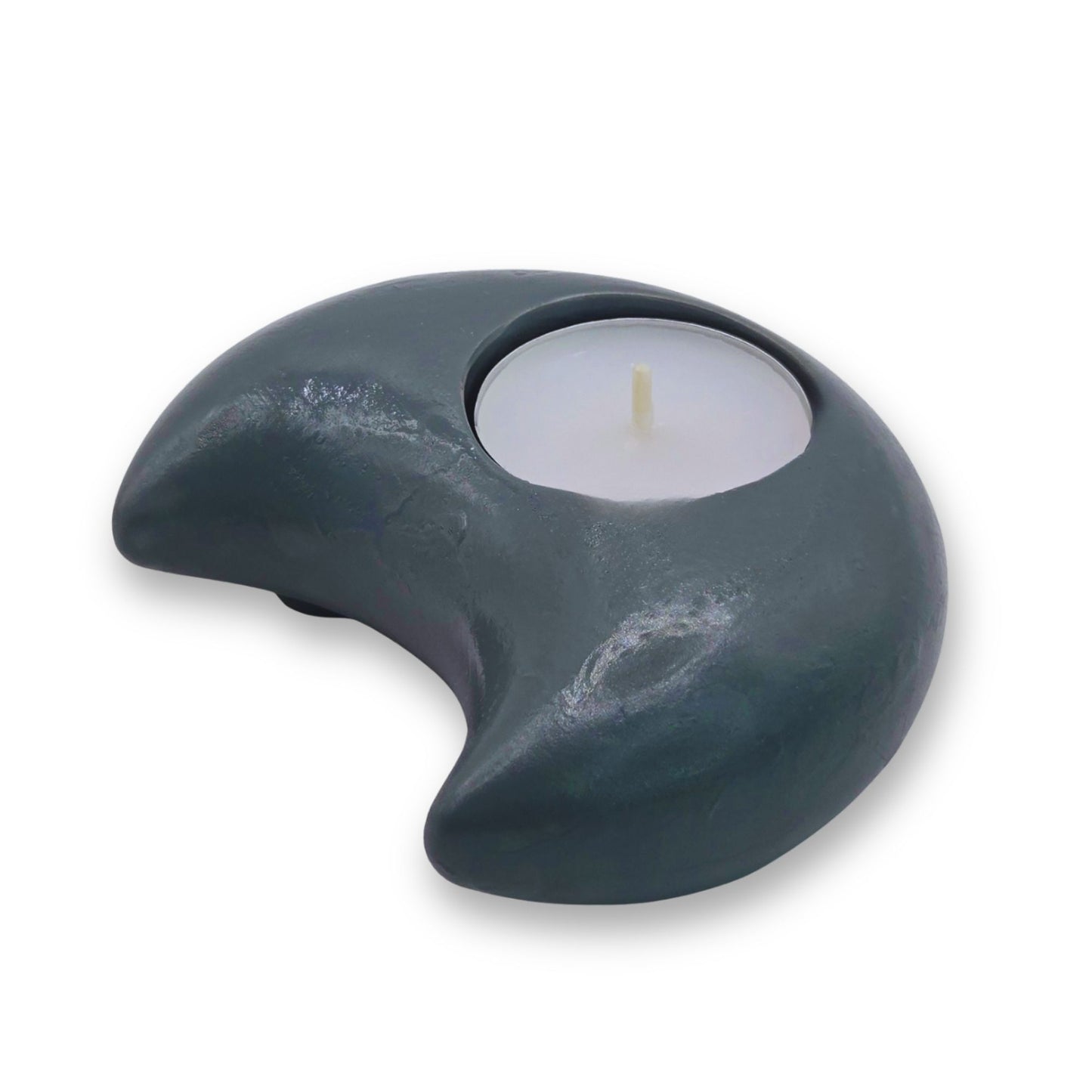 Tealight candle holder with a white candle on a white background