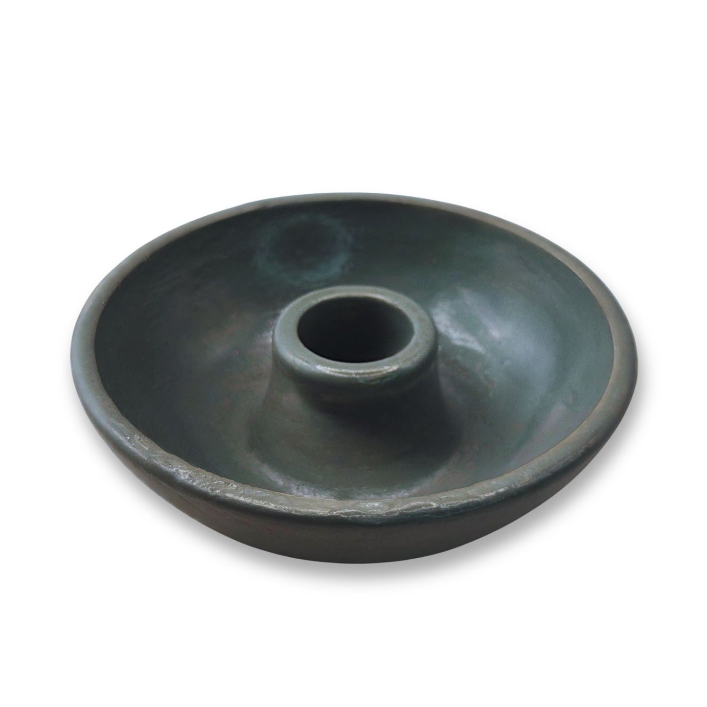 Dark gray round item on a white background