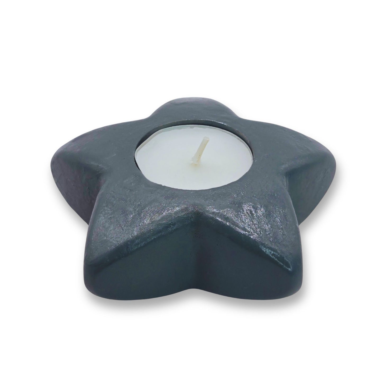 Star-shaped candle holder with a candle inside on a white background