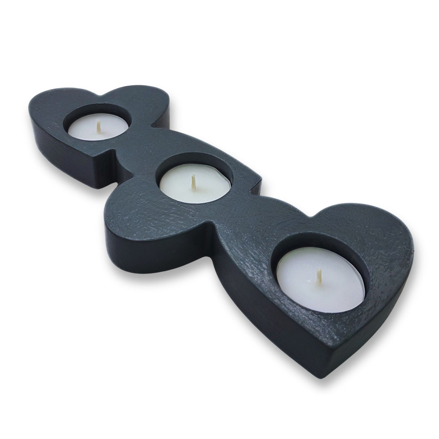 Black heart-shaped candle holder with three candle holders on a white background