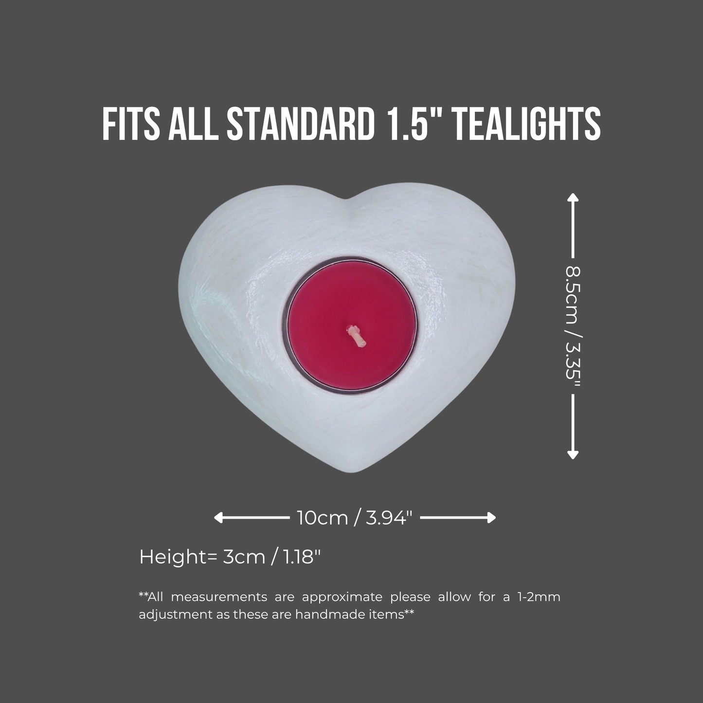 Heart-shaped candle holder with a red tealight on a gray background, showing measurements.