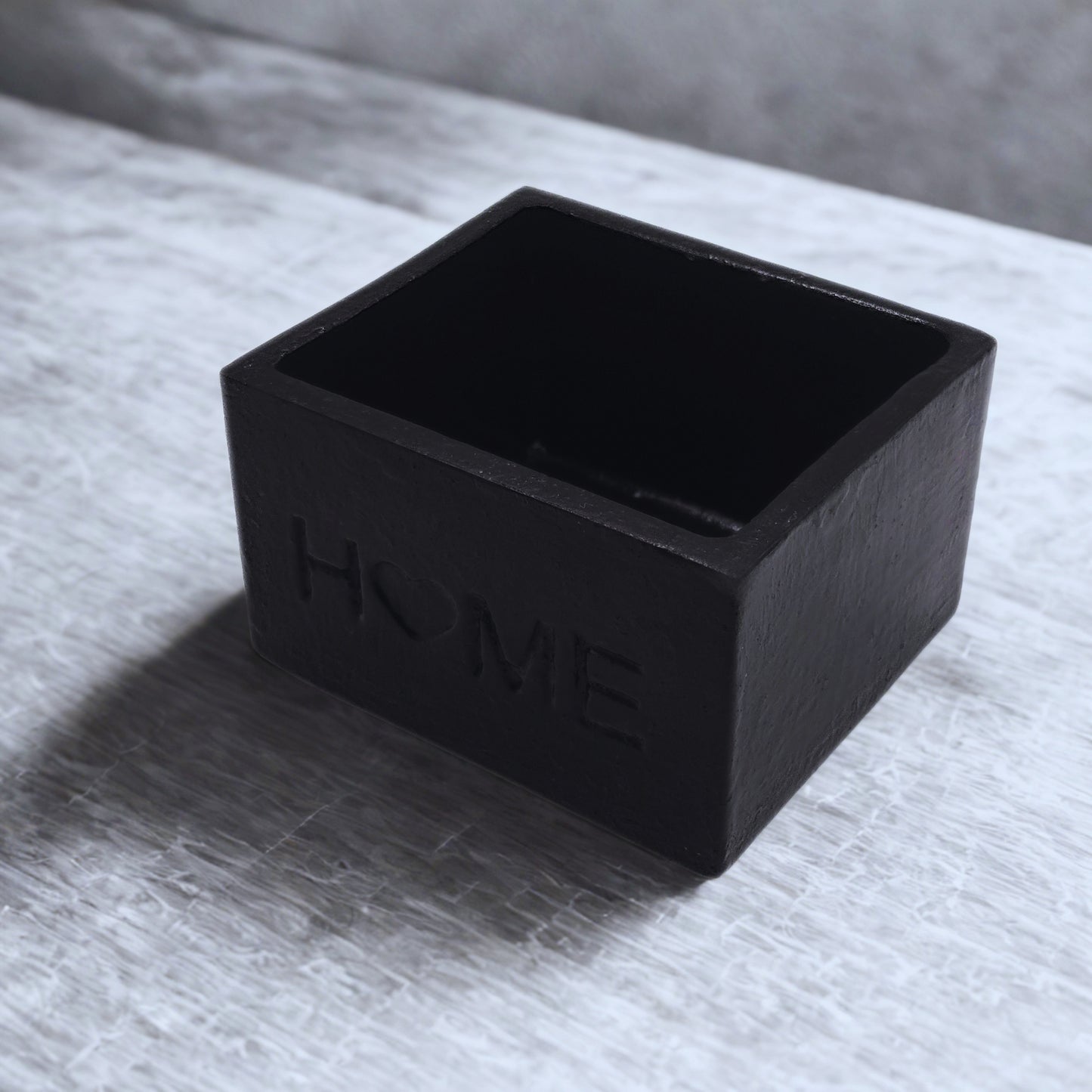 Black object on a textured surface