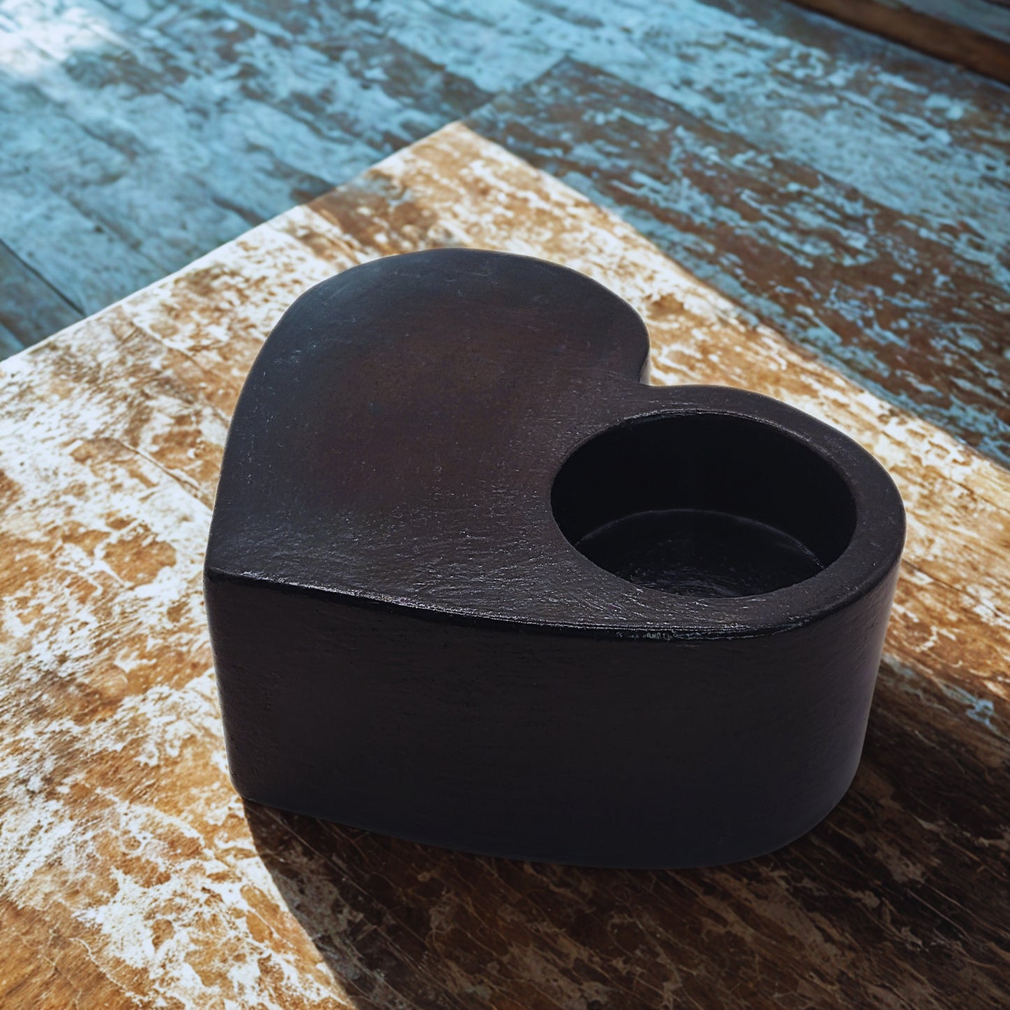 Black Large Heart tealight holder on a wooden surface