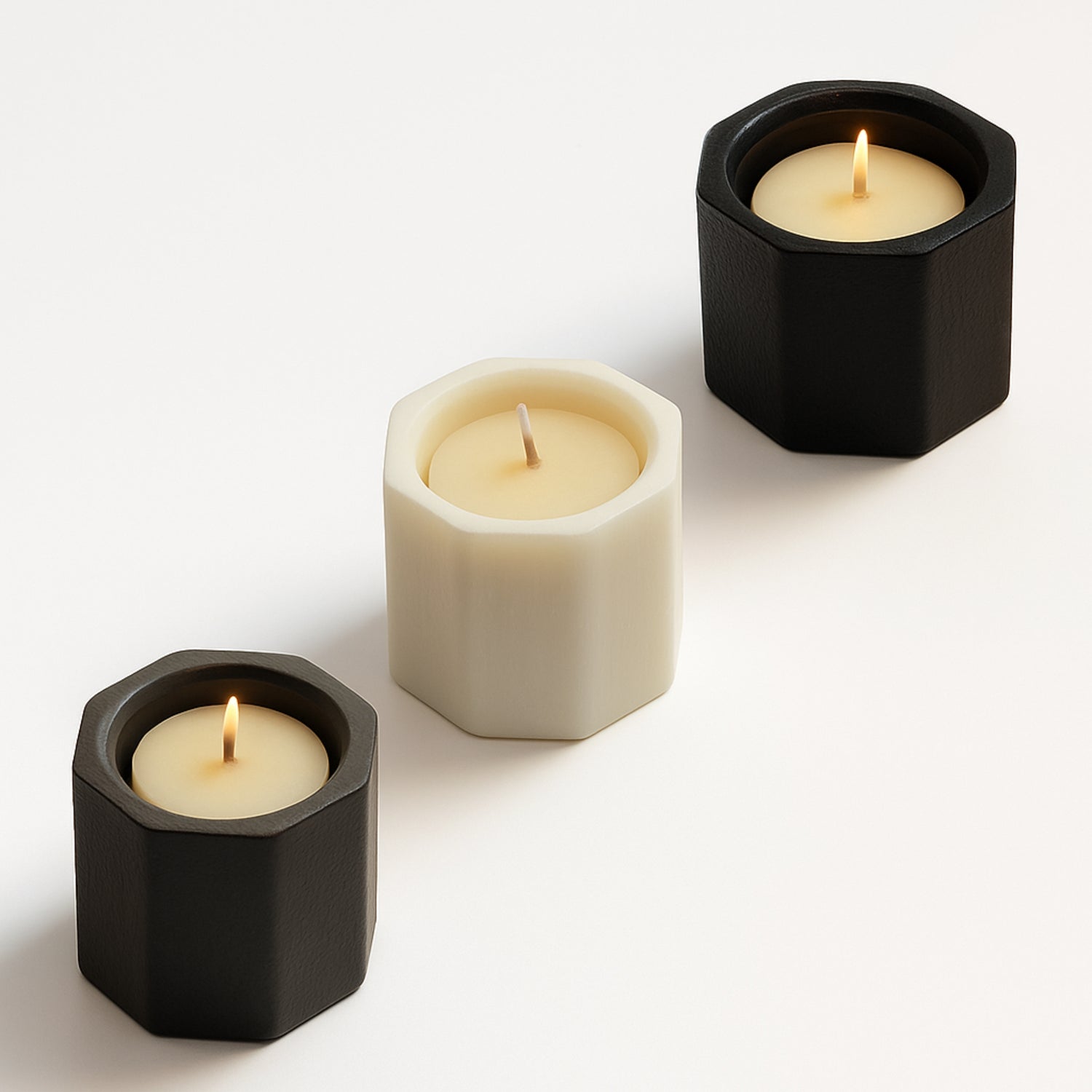 Three octagonal candle holders in on a white background