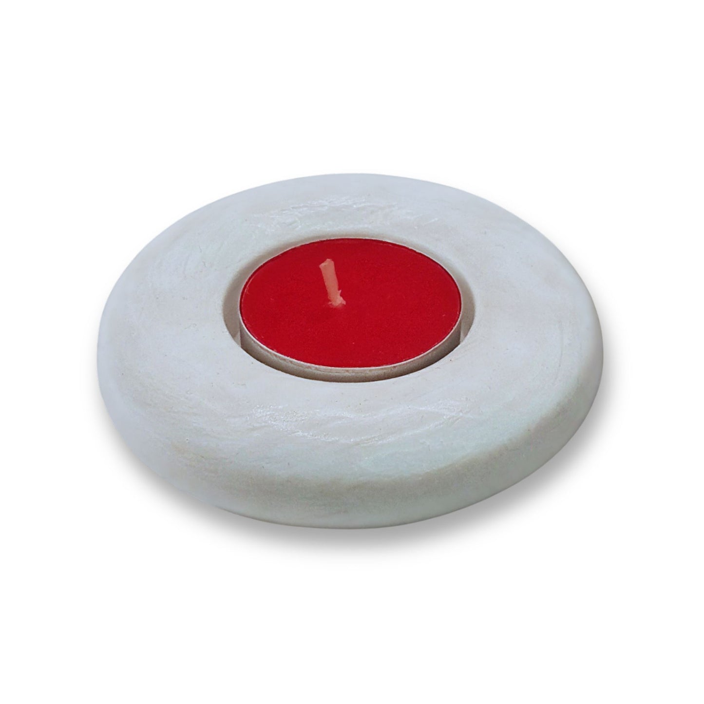 White candle holder with a red candle on a white background