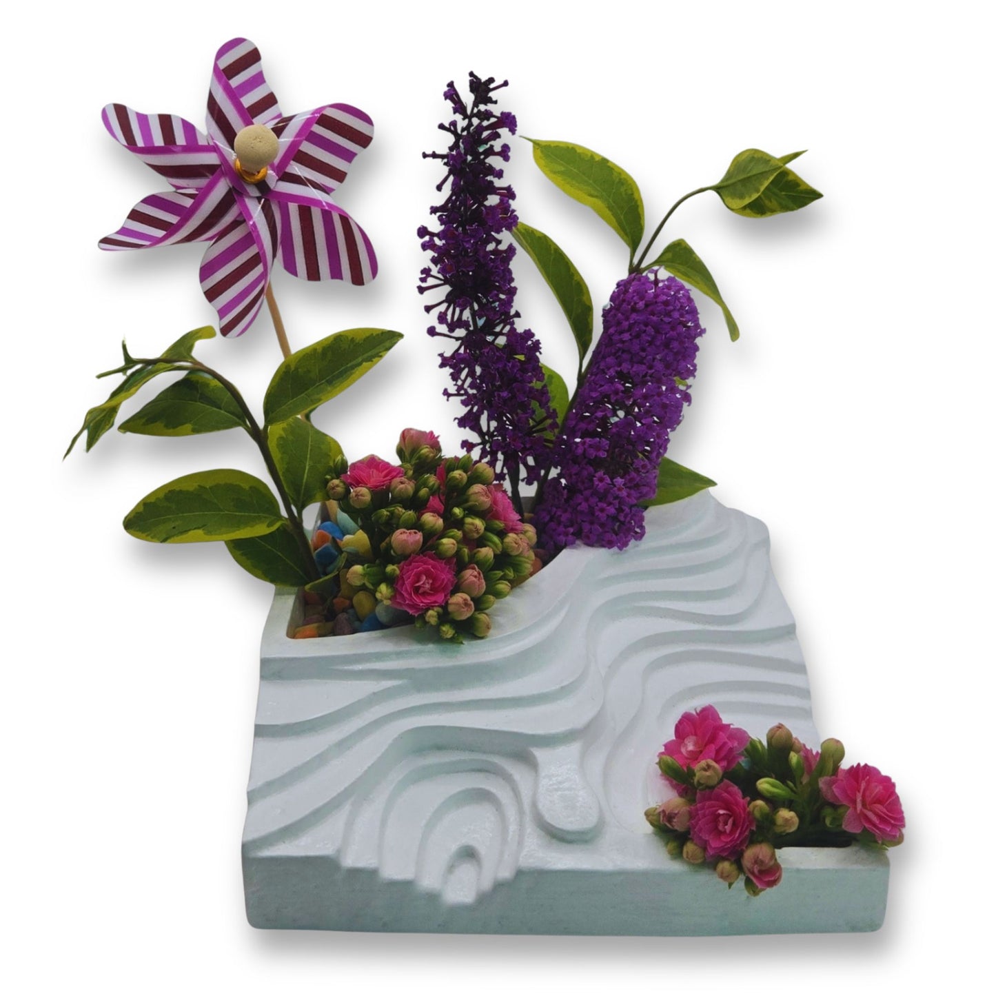 Decorative planter with flowers on a white background