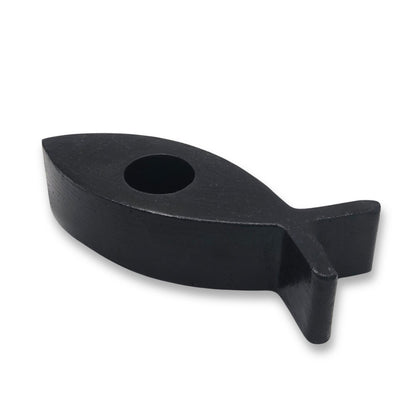 Black fish-shaped candle holder on a white background