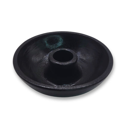 Black round item on a white background