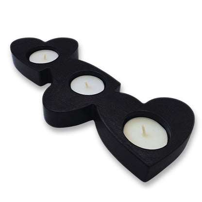 Object with four candle holders on a white background