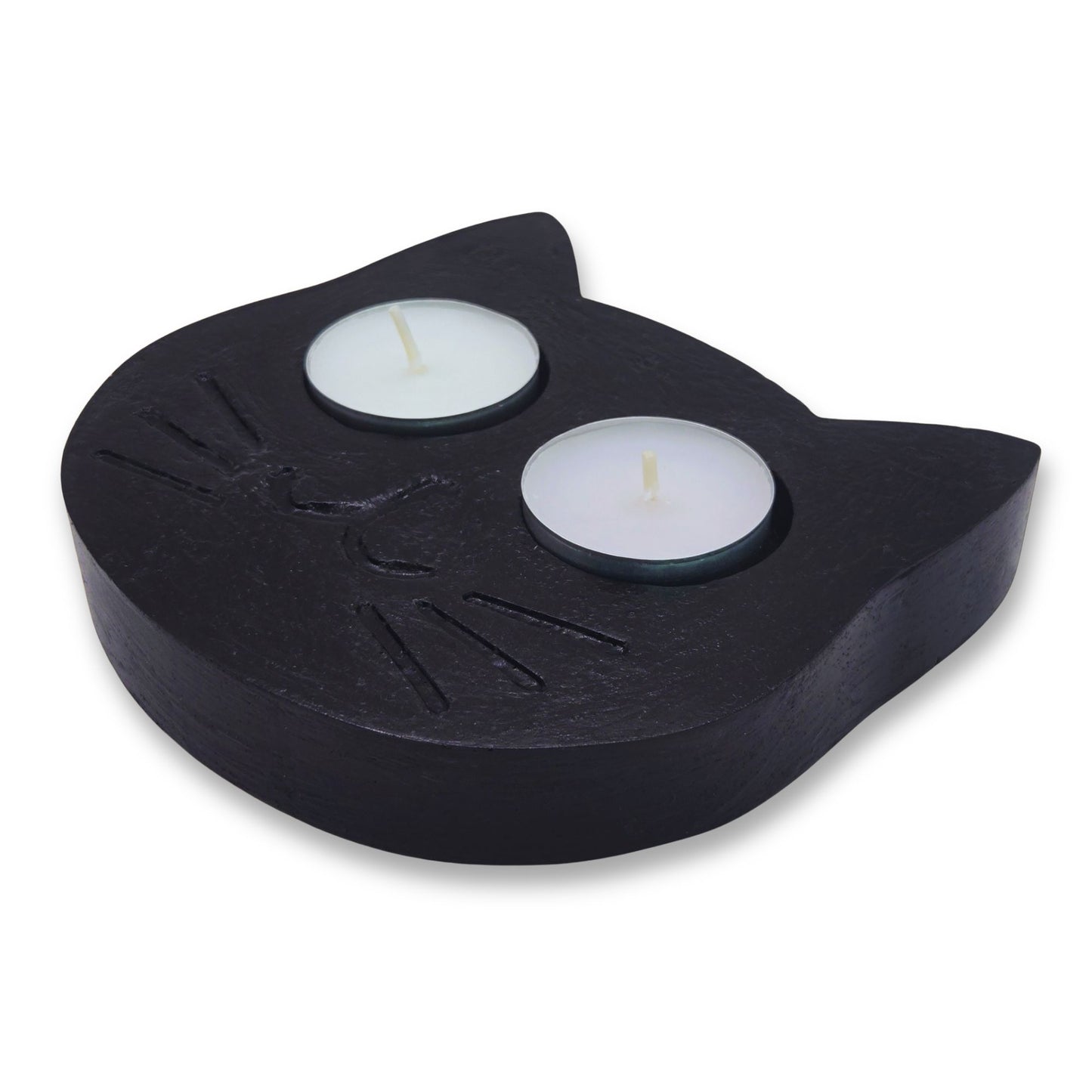Black cat tealight holder with two lit candles on a white background
