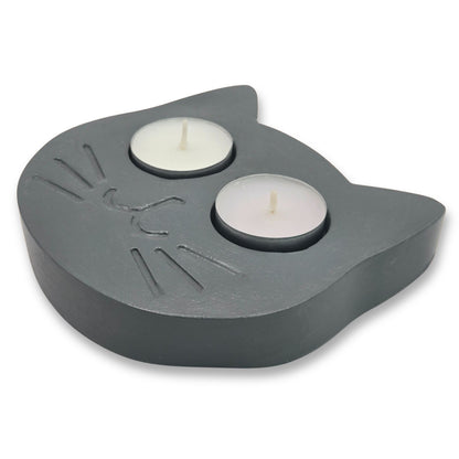 Gray cat tealight holder with two candles on a white background