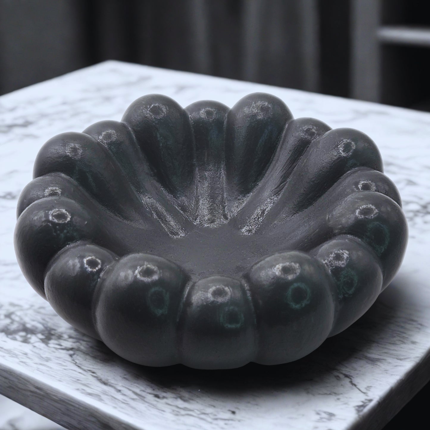 Grey Cloud Jewellery Bowl on a white surface with a blurred background