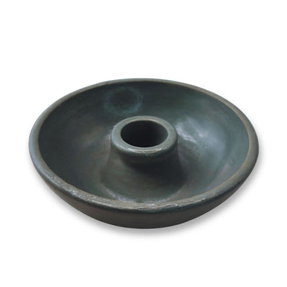 Dark gray round item on a white background
