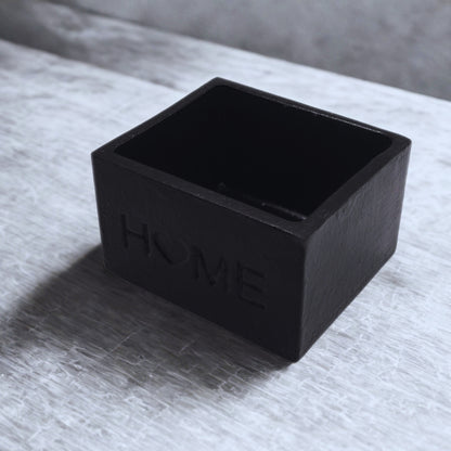 Black object on a textured surface