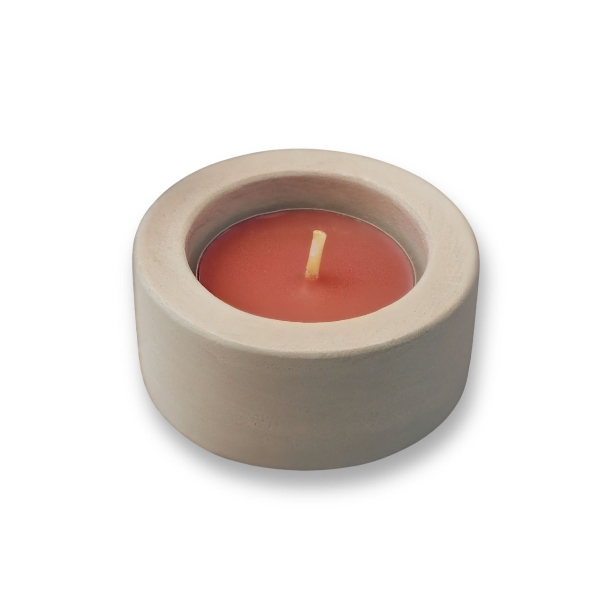 White round tealight holder with a red candle on a white background